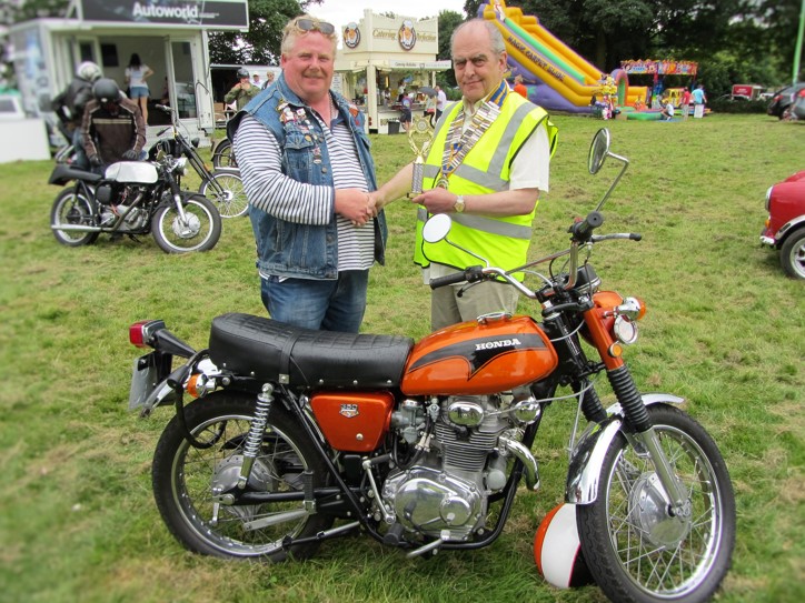 ‘Best Bike’ owner Bill Rimmer (left) being presented with his winning trophy by Chesterfield Rotary president Mike Cudzich-Madry